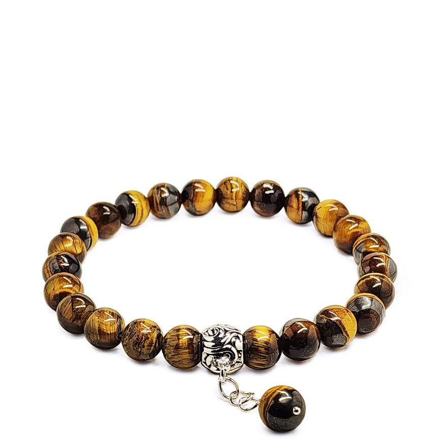 Tiger eye beaded bracelet with a silver chain and charm laying on a white background