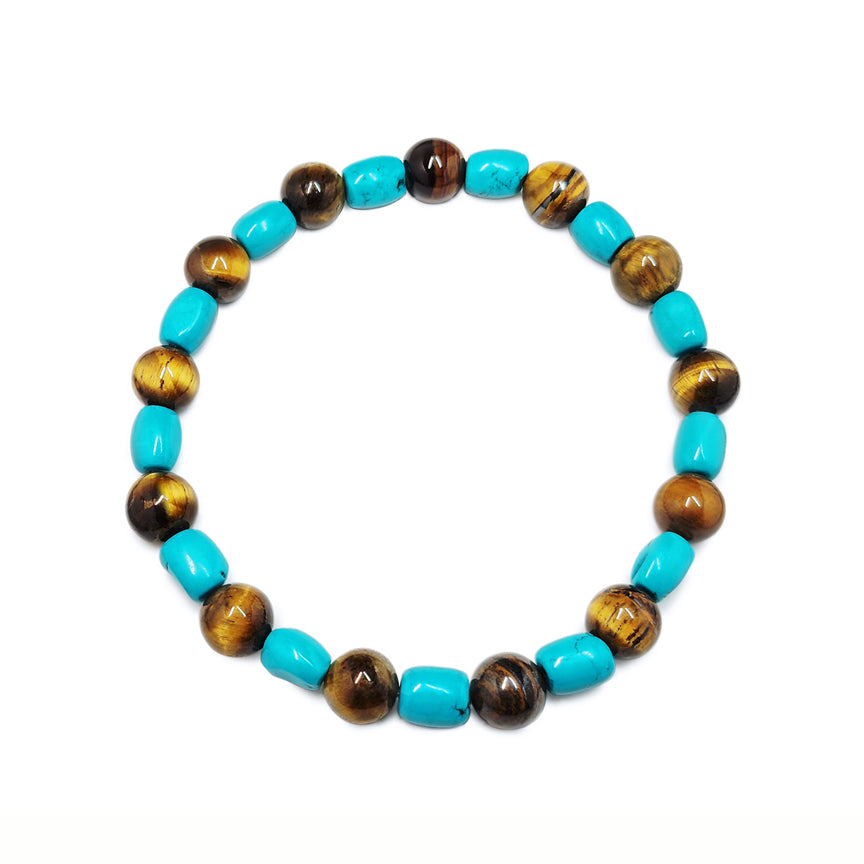 Turquoise and tigers eye bracelet floating over a white background