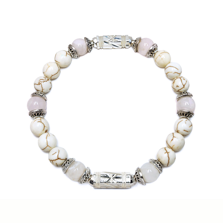 White howlite bracelet with white jade and silver floating over a white background
